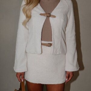These three boutique sweater and skirt set